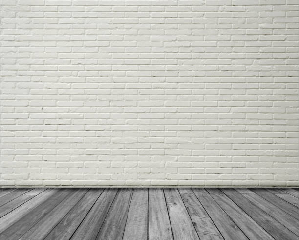 istock Empty space studio room of white brick wall and wooden floor. 1190129530