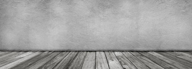 istock Empty space studio room of white concrete wall and wooden floor. 1190129560