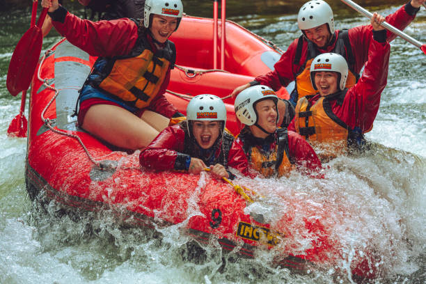 Whitewater rafting, Rotorua Kaituna River, Rotorua, New Zealand, November 23, 2019. Whitewater rafting - Tourists getting surfed on the bottom hole of the Kaituna River. inflatable raft stock pictures, royalty-free photos & images