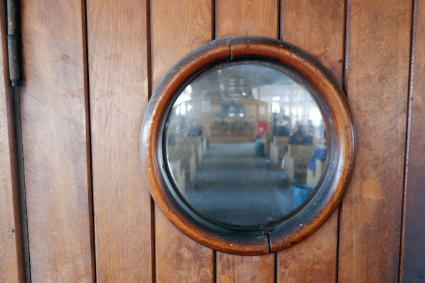 detail shot of a wooden door with round glass. - wood yacht textured nautical vessel imagens e fotografias de stock