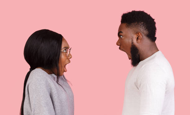 istock Young couple yelling at each other in studio 1190131718