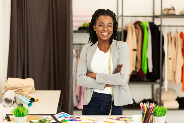 istock Confident Black Tailor Smiling Standing In Dressmaking Atelier 1190131845