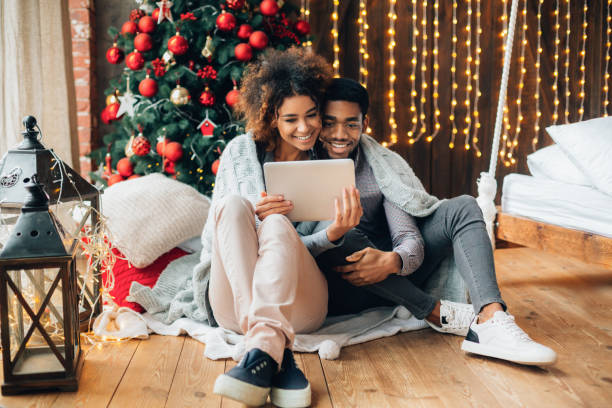 istock Couple in love making video call on a tablet 1190132825