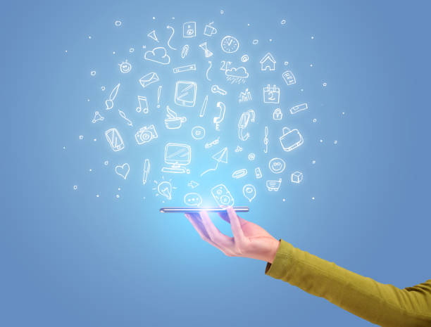 istock Hand with phone and drawn office icons 1190132907