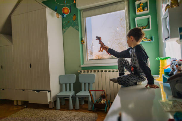 istock Little boy's playing in his room 1190132916