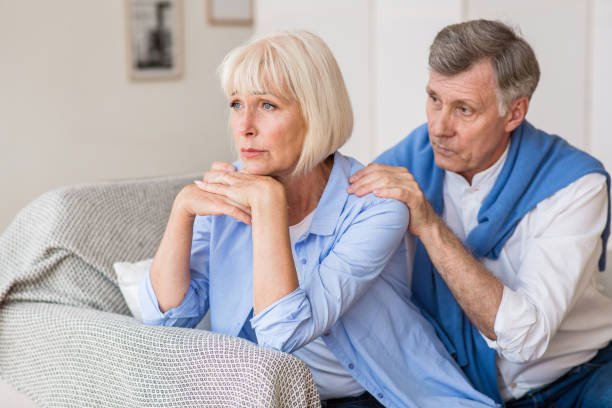 istock Relationship problems. Senior man consoling wife after quarrel 1190133154