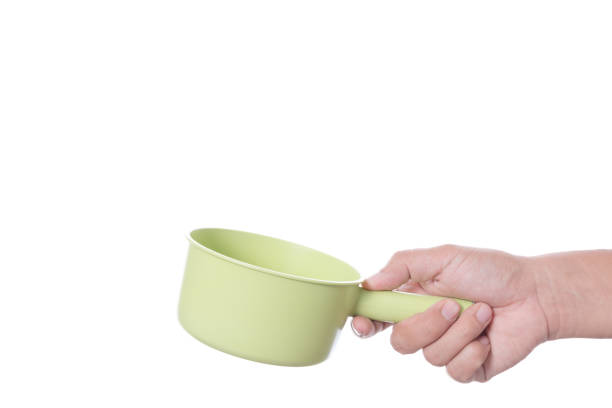 istock Hand holding plastic bath bowl for shower or watering 1190134046