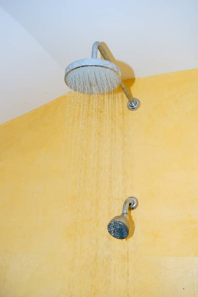 istock Shower head with running water 1190134177