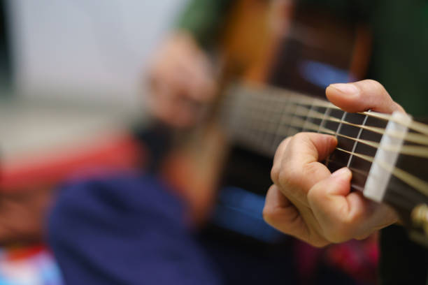 istock Acoustic guitar playing with fingertip 1190134253