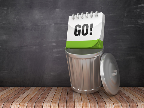 Trash Can with GO! Calendar on Chalkboard Background - 3D Rendering