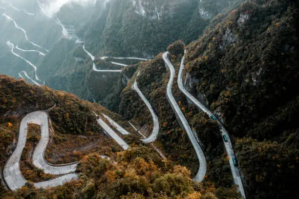 Photo of High altitude view of a long slithering curvy mountain road of Zhangjiajie (张家界), on Tianmen mountain (天门山)