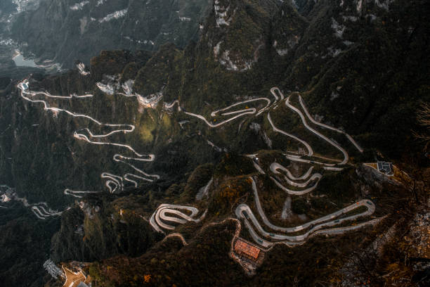 Aerial view of serpentine roads of Tianmen Mountain, Zhangjiajie (Zhangjiajie) east China Aerial view of serpentine roads of Tianmen Mountain (天门山), east China. zhangjiajie photos stock pictures, royalty-free photos & images
