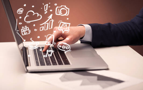 istock Office worker sitting in front of laptop 1190138327