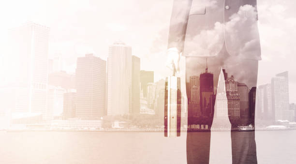 istock Businessman standing at cityscape background 1190138453