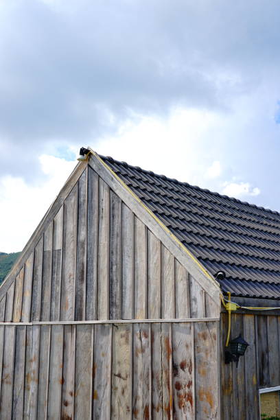 istock Grey roof shingle with blue sky background 1190140932