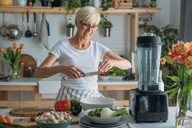 istock Woman Preparing Food at Kitchen 1190142733