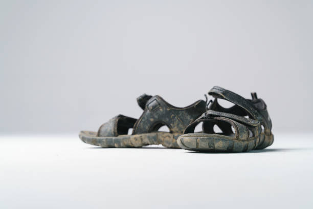istock Dirty feet with sandal shoes 1190143257