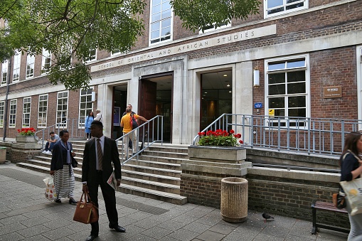 People visit SOAS Building at University of London, UK. The School of Oriental and African Studies (SOAS) is among top universities in Britain.