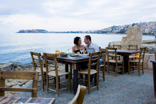 People sitting at popular  Posedion Restaurant in Kaleköy Village, Gökçeada.