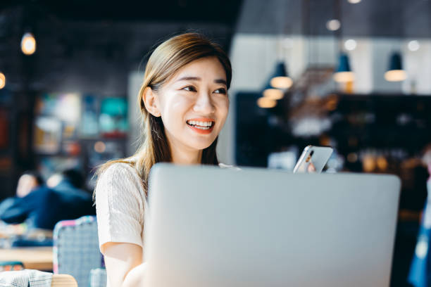 istock Asian Businesswoman working at cafe. 1190147287