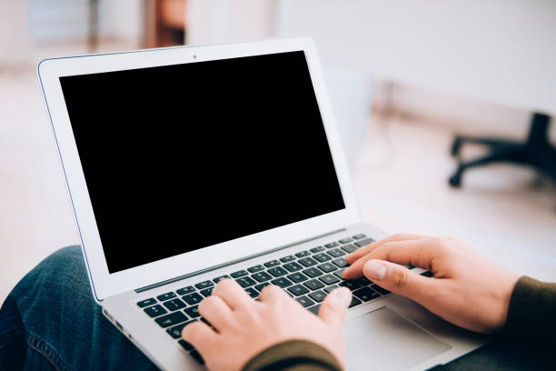 istock Man working with laptop in office interior 1190147352