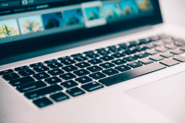 istock Man working with laptop in office interior 1190148712