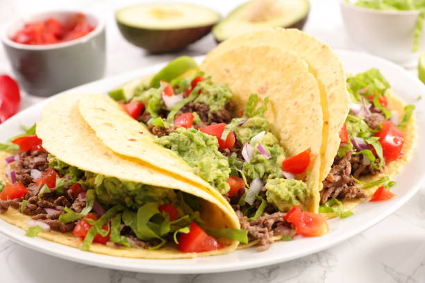 tacos with beef, avocado and tomato