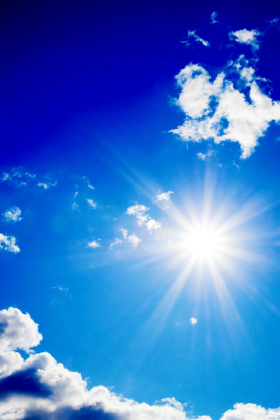 istock Bright sun with beautiful beams in the sky with clouds 1190150879