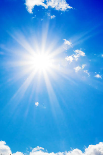 istock Bright sun with beautiful beams in the sky with clouds 1190150892