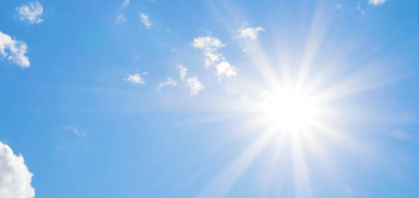 istock Bright sun with beautiful beams in the sky with clouds 1190150907