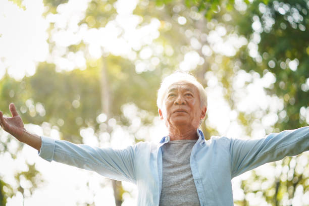 istock asian senior man relaxing outdoors 1190151121
