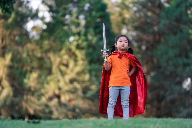 istock Wonder Girl Holding a Sword 1190156171