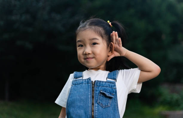 istock Cute Girl Listening 1190156176