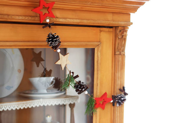 istock chain with christmas ornaments hanging on a retro cabinet 1190156256
