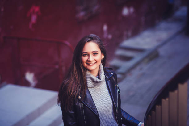 istock woman in black leather jacket 1190156635