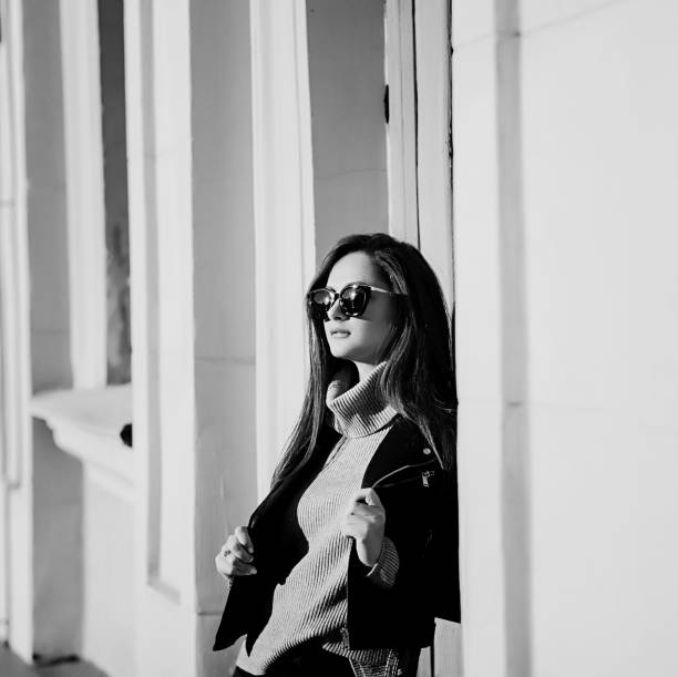 istock Glamorous young woman in black leather 1190156691