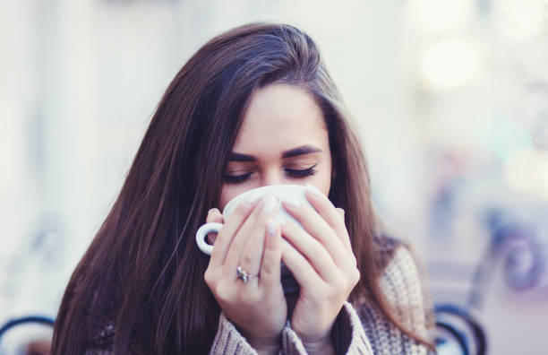 istock young woman drinking coffee 1190156765