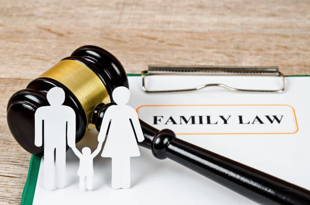 istock Family figure and gavel on table. 1190159610