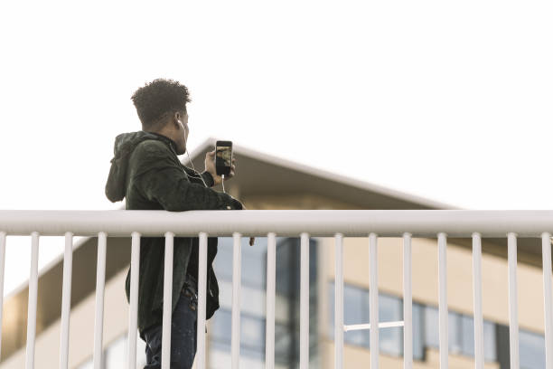 istock black man taking a selfie for social media 1190161690