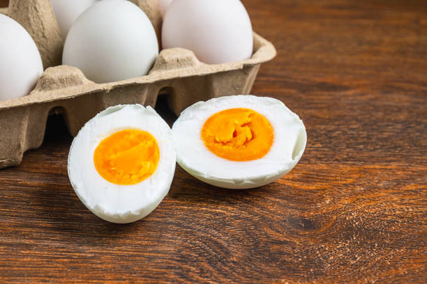 istock White duck eggs and salted egg food on a wooden table 1190162031