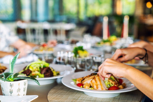 A group of people is dining in a elegance restaurant or hotel.