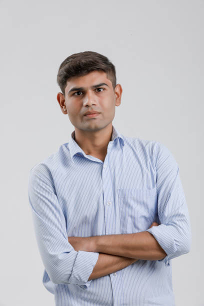 istock young indian man Standing over white background 1190165625