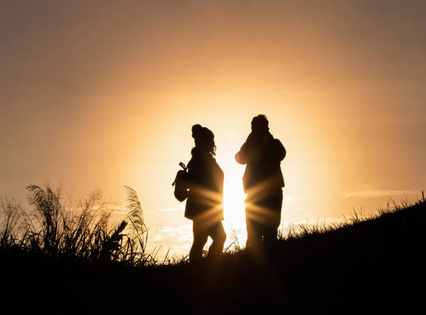 istock Silhouette couple  on the mountain 1190165955