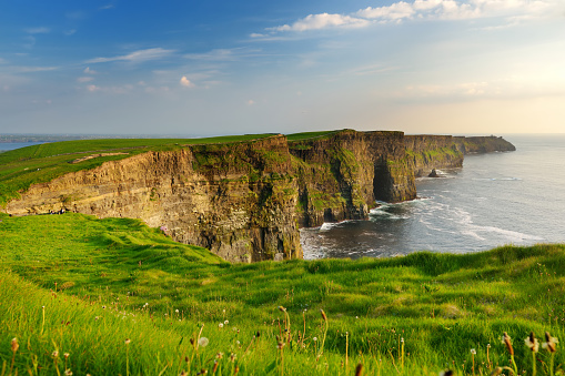 World famous Cliffs of Moher, one of the most popular tourist destinations in Ireland. Beautiful view of widely known tourist attraction on Wild Atlantic Way in County Clare.