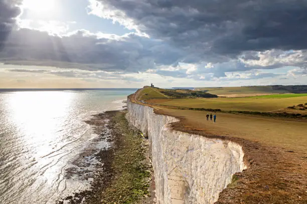 Panoramic view of Seven Sisters cliffs with lighthouse and sea