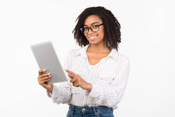 istock Portrait of young black woman using digital tablet 1190167497