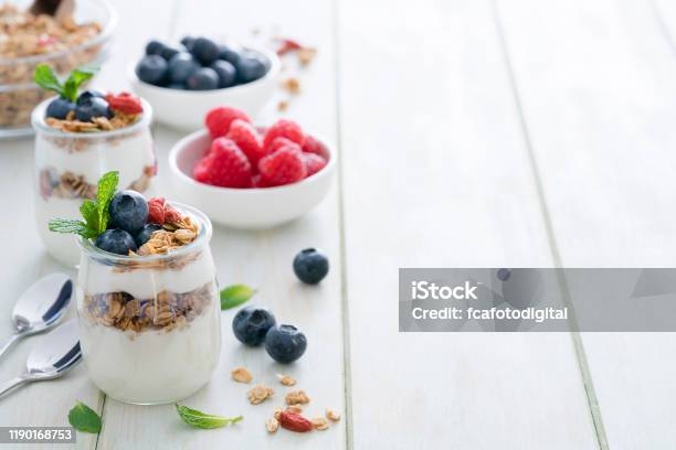 Healthy Food Homemade Yogurt With Granola On Breakfast Table Copy Space Stock Photo - Download Image Now