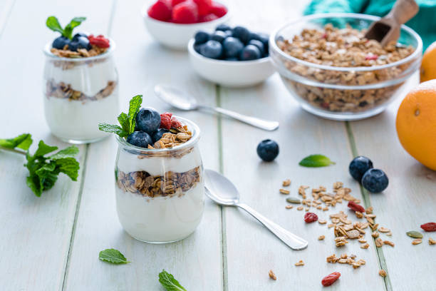 istock Healthy food: homemade yogurt with granola on breakfast table. 1190168795