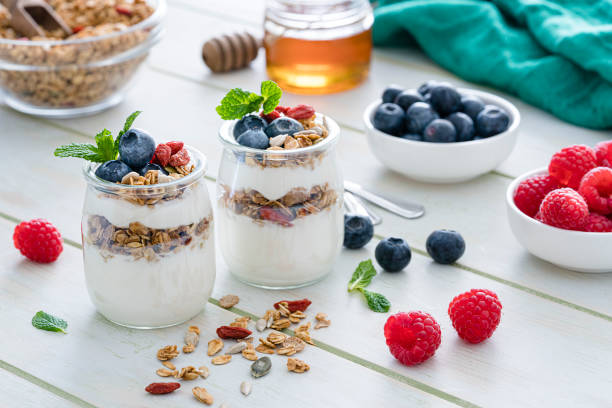 istock Healthy food: homemade yogurt with granola on breakfast table. 1190168797