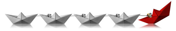 istock Leadership Concept - Paper boats on white background 1190169181
